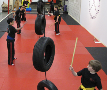 Students practicing on tires